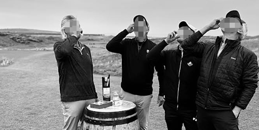 Golfers having a drink of whisky before teeing off at Dumbarnie